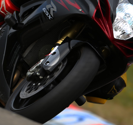 In the middle of the picture, just at the lower end of the forks, you can see a red cable tie. That's where it should be...