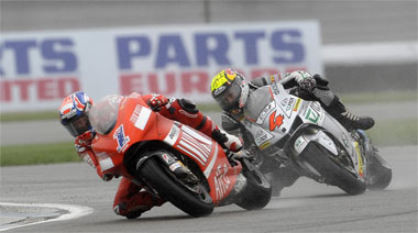 Casey Stoner and Andrea Dovizioso slug it out early on. Stoner is having to work extra hard and it shows here, even though he prevailed...
