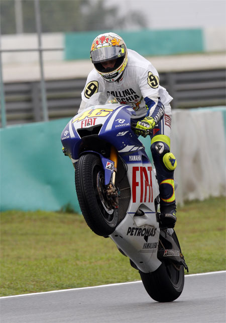 Valentino Rossi, MotoGP Champion, 2009 Check out the chicken feathers on his lid... (Yamaha)