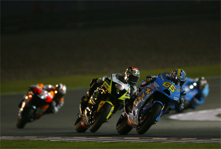 Capirossi doing what he still does best. Riding the wheels off his bike...
