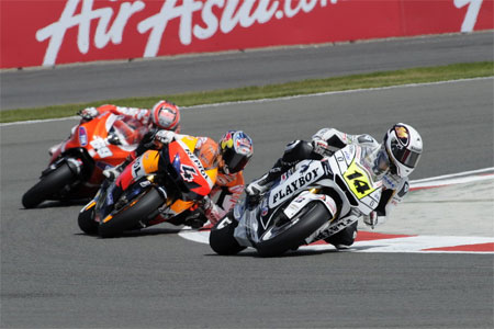 Randy de Puniet riding the wheels off the LCR Honda ahead of Dovizioso and Hayden