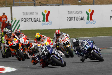 Lorenzo leads Stone out of the first corner while Simoncelli tries to work out what just happened.... (Pic: Yamaha)