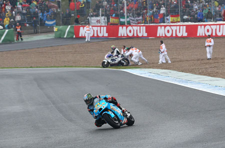 There was a lot of this going on. Abraham gets a hand from the marshals as Hopper rides past (Suzuki)