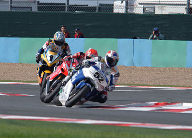 After twenty three laps, the leading trio was this close. That's what four tenths of a second looks like - the distance from Toseland (52) to Corser (1)...