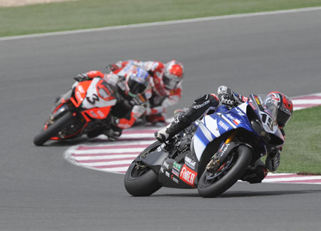 Ben Spies powers away from Biaggi and Haga at the end of Race One. He's quite good, you know... (Yamaha)