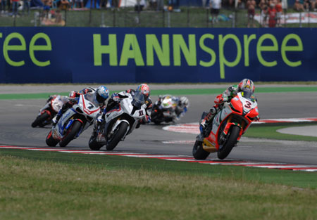 Something we're getting used to seeing - Troy Corser and the BMW making a brilliant start and taking the lead...before being passed by Max Biaggi on that pesky Aprilia