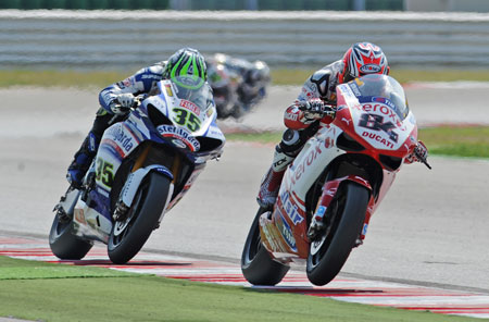 No love lost here, I suspect. Look closely to see the various bits of other bikes' paint on Fabrizio's fairing, knees, elbows... (Pic: Richard Handley)