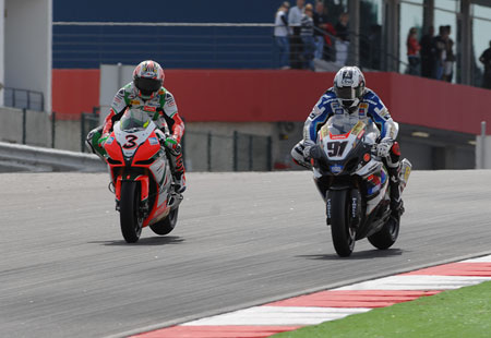 The braking zone at the end of the straight drops away. Catches some people out, too. Biaggi outbrakes Haslam to take the lead...