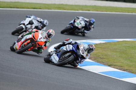 Melandri leads Biaggi. Haslam is not amused, but holds Laverty behind him. (Yamaha)