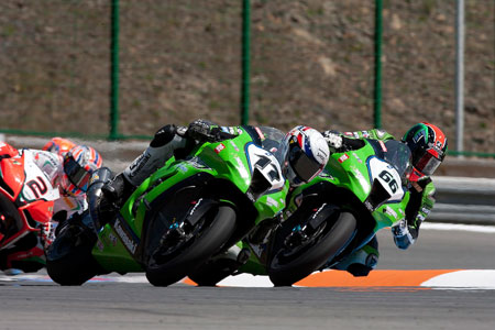 Lascorz and Tom Sykes battle it out while Leon Camier stands by to pick up the bits...(Pic: Paul Bird Kawasaki)
