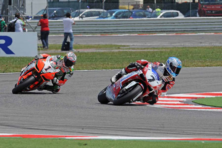 Checa gets past Biaggi. The crowd, strangely, did NOT go wild...