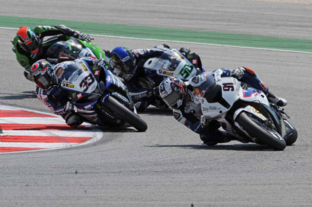 Leon Haslam fights to keep Melandri, Laverty and Sykes behind.