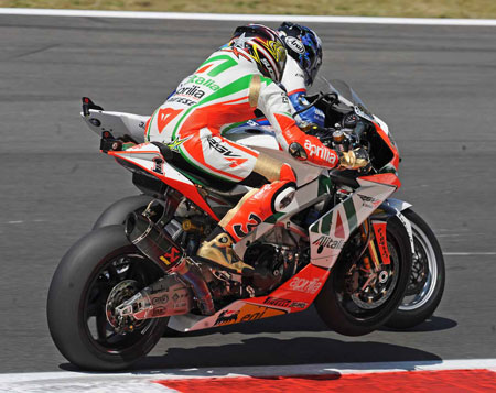 Leon Haslam puts the nhammer on Biaggi after one of the latter's many chicane mistakes.