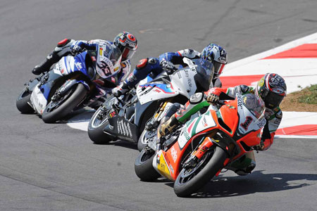 Biaggi has gone in too hot and is running wide while Haslam and Melandri slip by inside. Again...