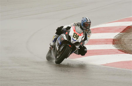 It's colder than Norway, it's raining, it's slippery as anything and Michel Fabrizio has the 'flu. Who said it's all glamour? (Pic: Suzuki)